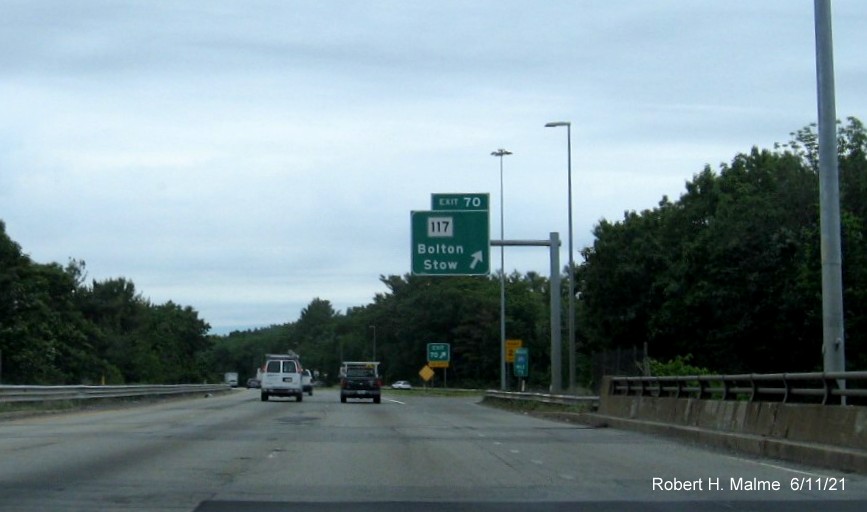 Image of overhead ramp sign for MA 117 exit with new milepost based exit number on I-495 North in Bolton, June 2021