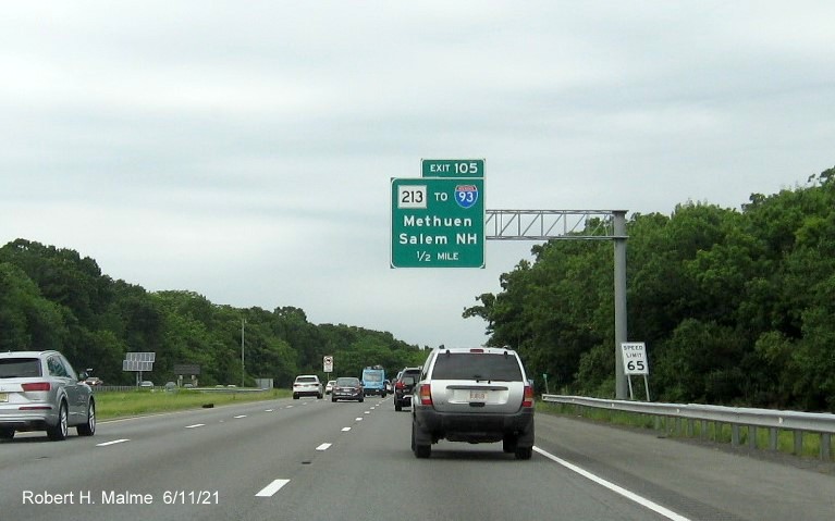 Image of 1/2 mile advance signage for MA 213 exit with new milepost based exit number on I-495 North in Lawrence, June 2021