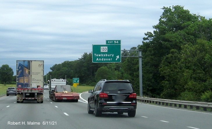 Image of overhead ramp sign for MA 133 exit with new milepost based exit number on I-495 North in Tewksbury, June 2021