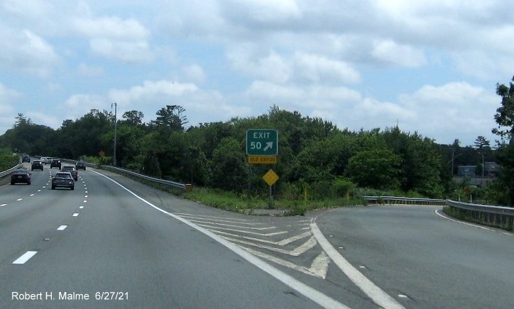 Image of gore sign for MA 85 exit with new milepost based exit number and yellow Old Exit 20 sign attached below, June 2021