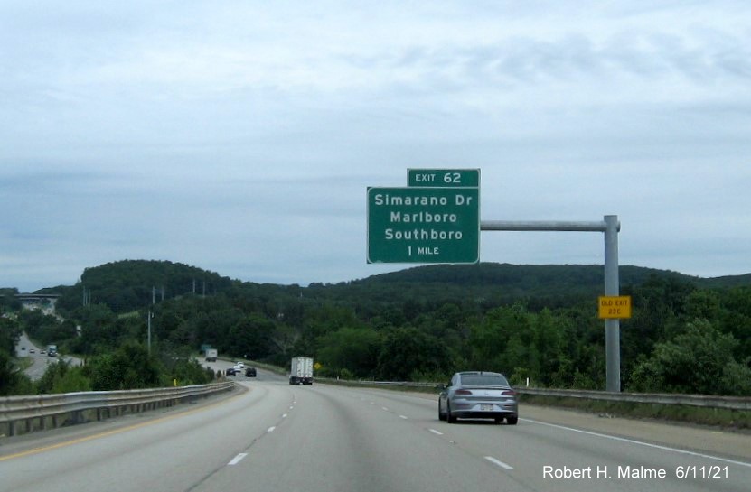 Image of 1 mile advance overhead sign for Simarano Drive exit with new milepost based exit number and yellow Old Exit 39C advisory sign on support on I-495 North in Southborough, June 2021