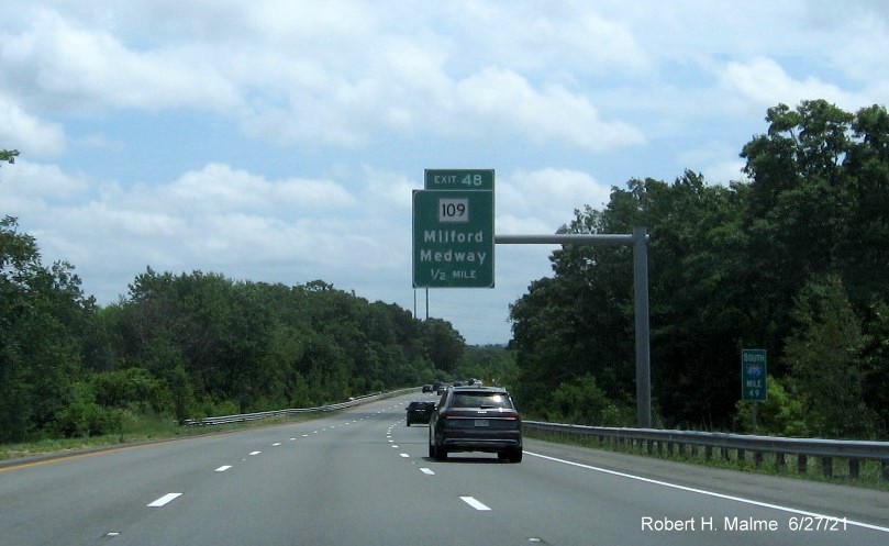 Image of 1/2 mile advance overhead sign for MA 109 exit with new milepost based exit number on I-495 South in Milford, June 2021