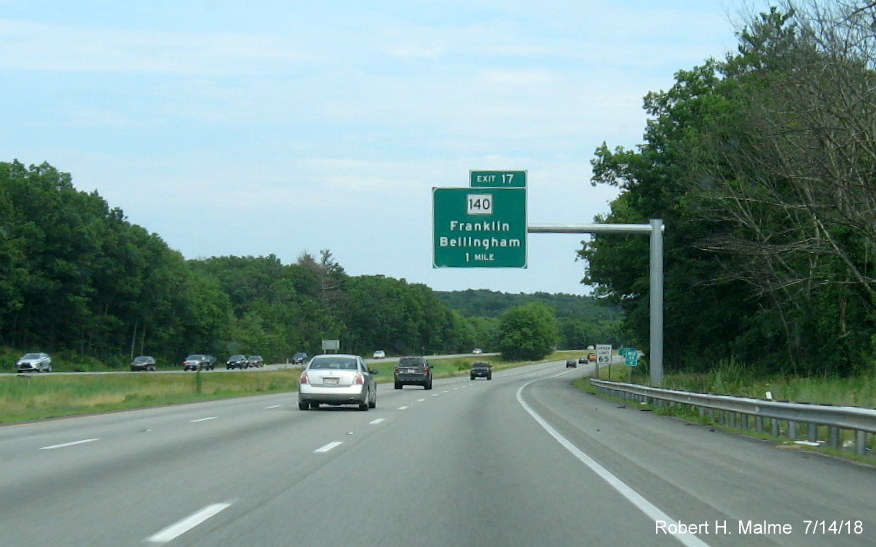 Image of recently placed 1-mile advance overhead sign for MA 140 exit on I-495 South in Franklin in July 2018