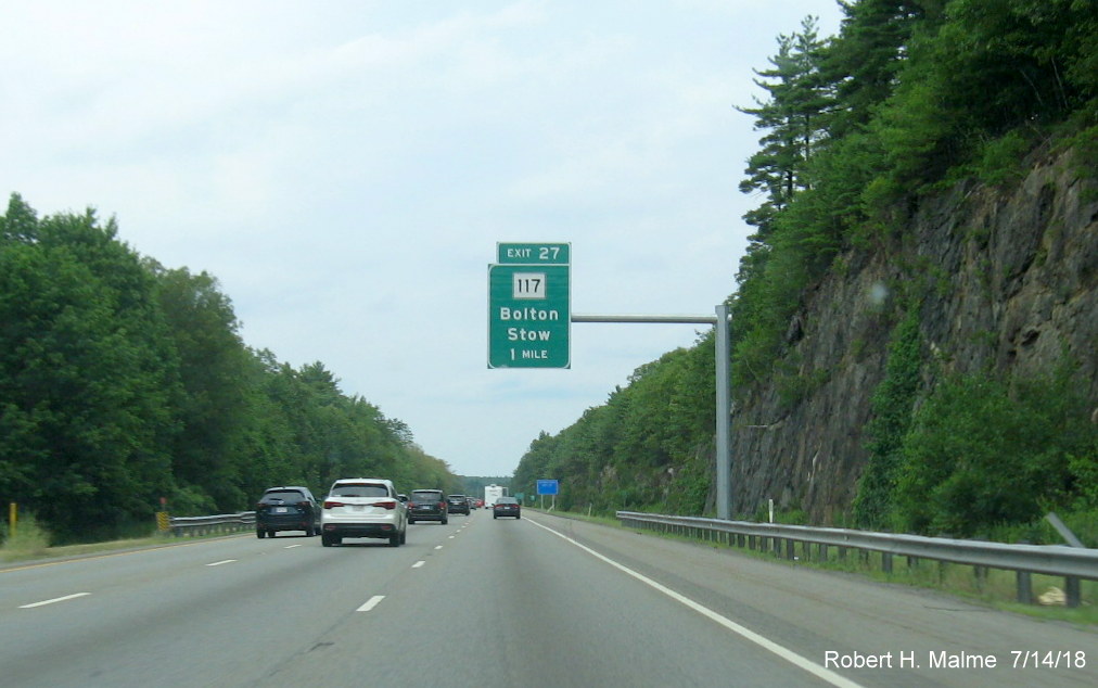 Image of 1-mile advance overhead sign for MA 117 exit on I-495 North in Bolton in July 2018
