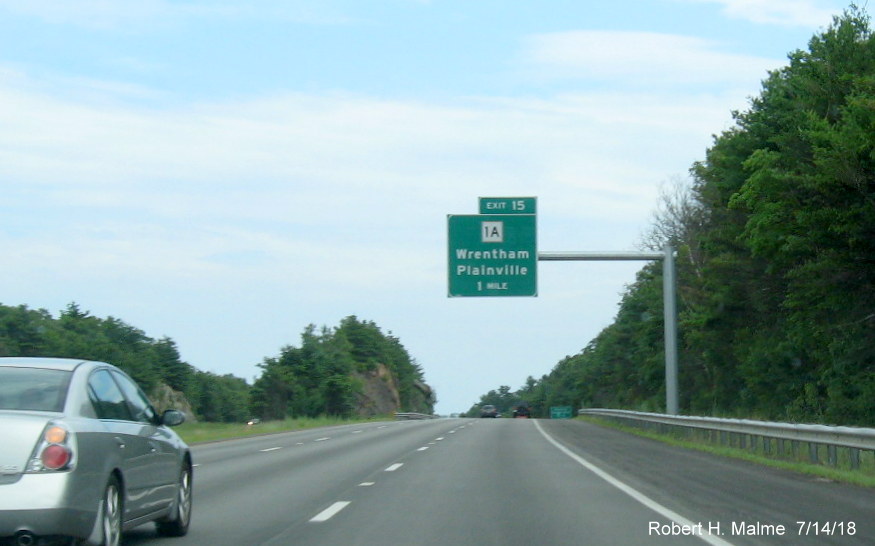 Image of recently placed 1-mile advance overhead sign for MA 1A exit on I-495 South in Wrentham in July 2018