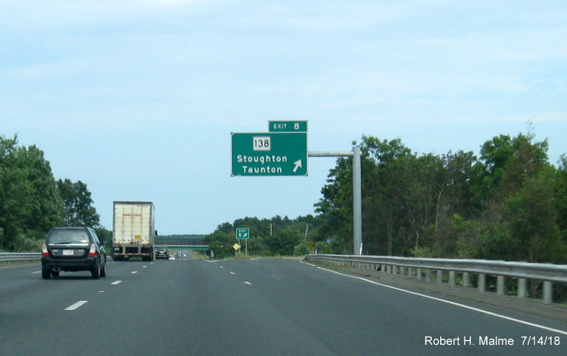 Image of recently placed overhead ramp sign for MA 138 exit on I-495 South in Raynham in July 2018