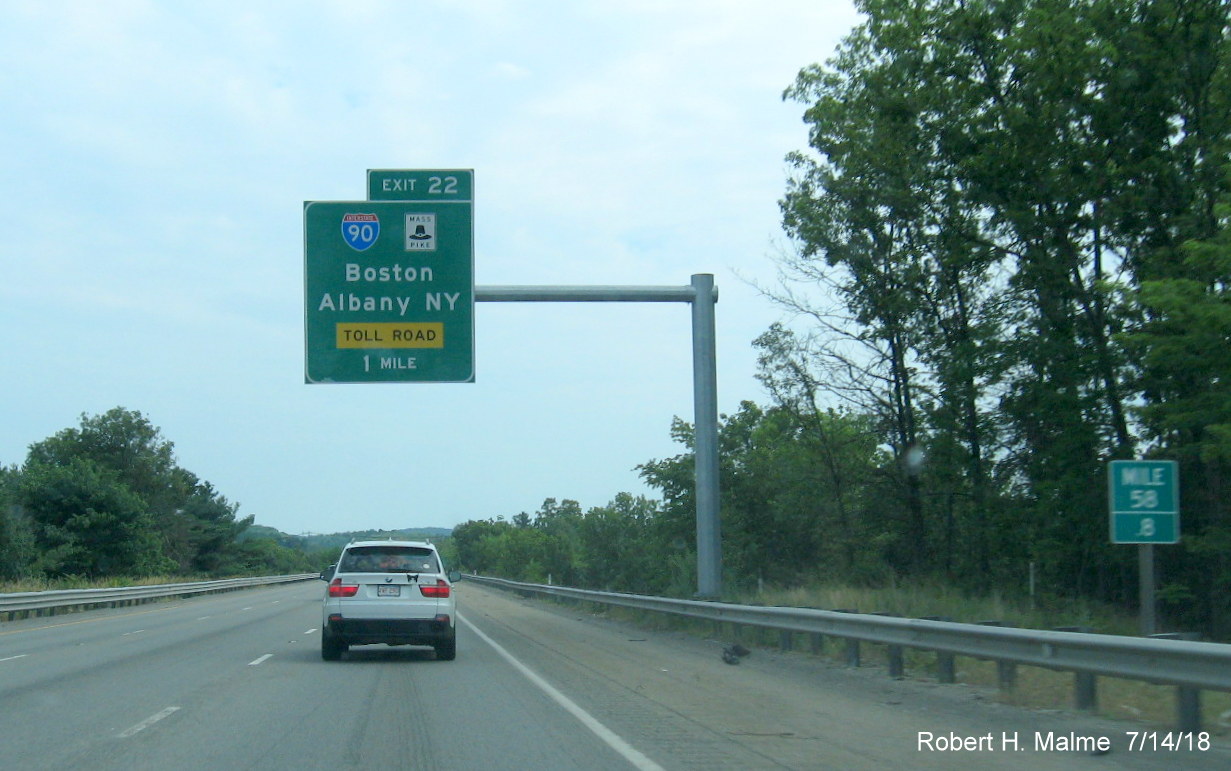 Image of recently installed 1-mile advance overhead sign for the I-90/Mass Pike exit on I-495 South in Southboro in July 2018