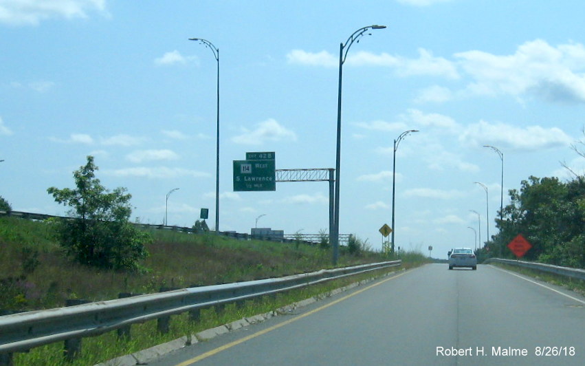 Image of 1/2 mile advance sign for MA 114 West exit as seen from ramp from Massachusetts Avenue to I-495 South in North Andover
