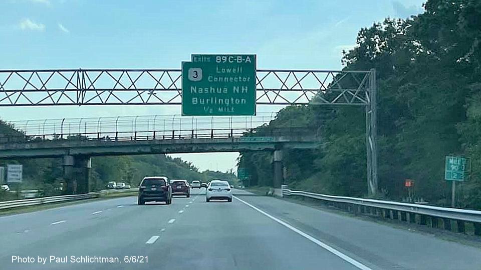 Image of 1/2 mile advance overhead sign for US 3/Lowell Connector exits with new milepost based exit numbers on I-495 South in Chelmsford, June 2021