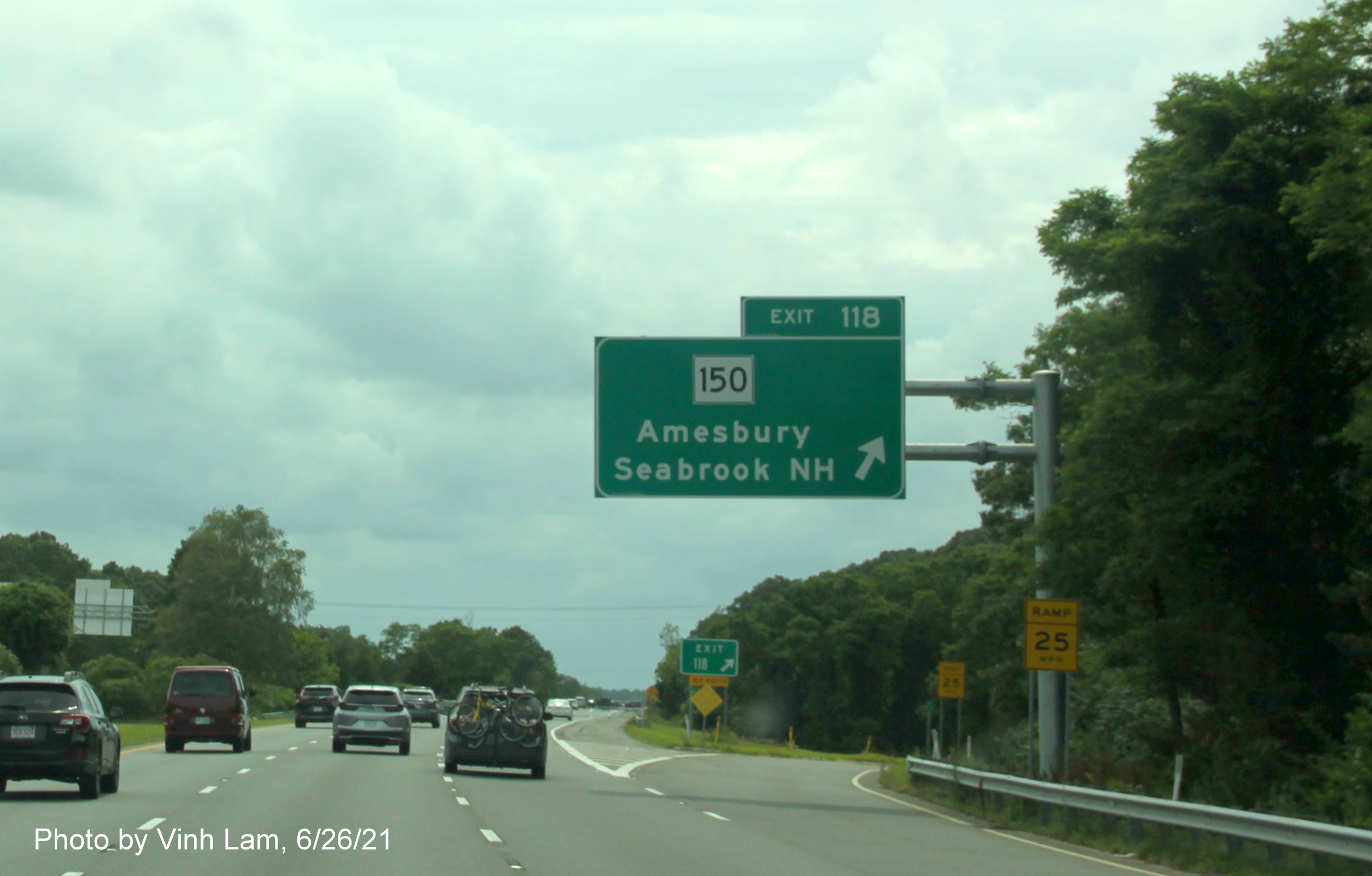 Image of overhead ramp sign for MA 150 exit with new milepost based exit number on I-495 South in Amesbury, photo bt Vinh Lam, June 2021