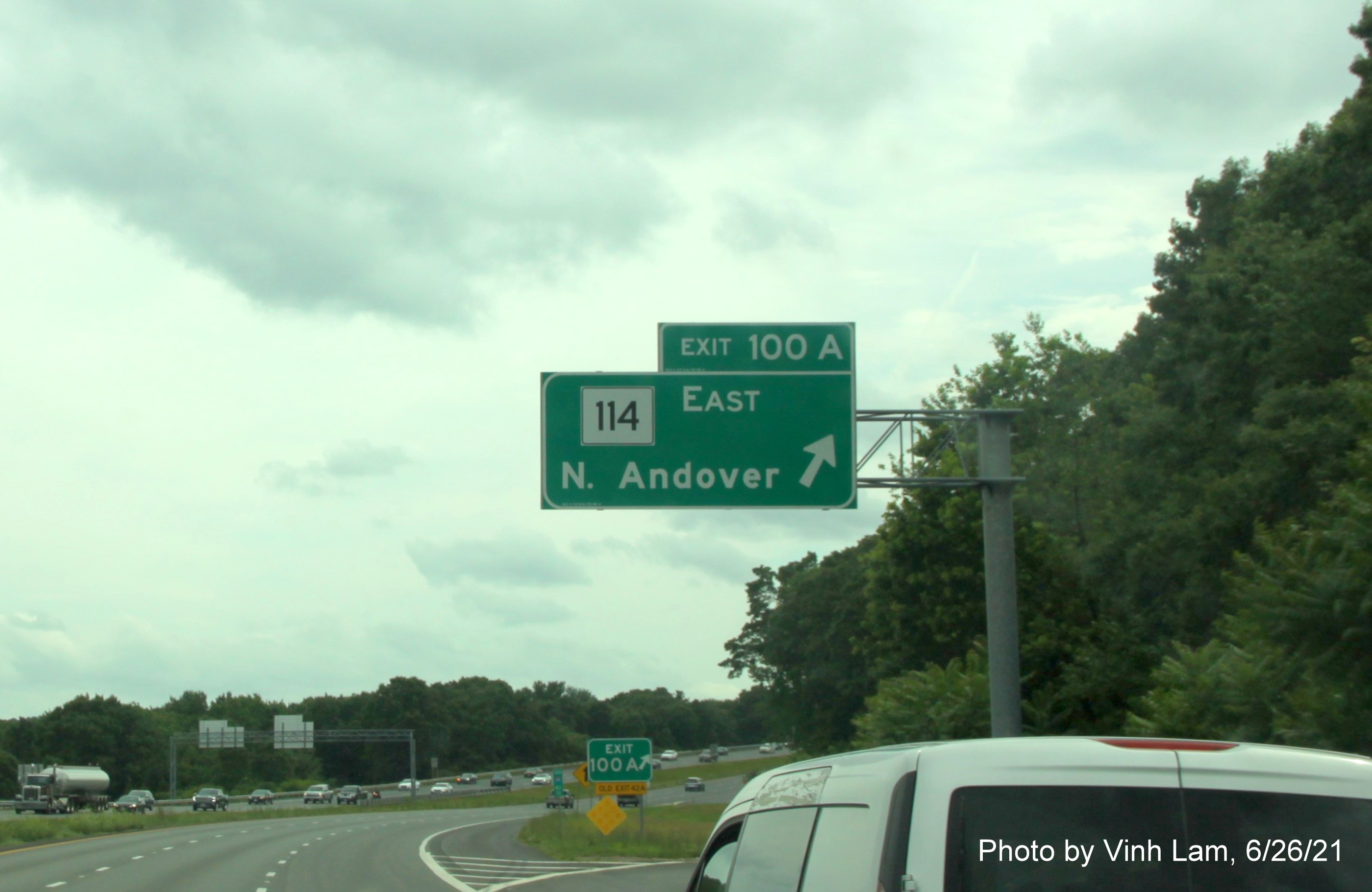 Image of overhead ramp sign for MA 114 East exit with new milepost exit number on I-495 South in North Andover, by Vinh Lam, June 2021