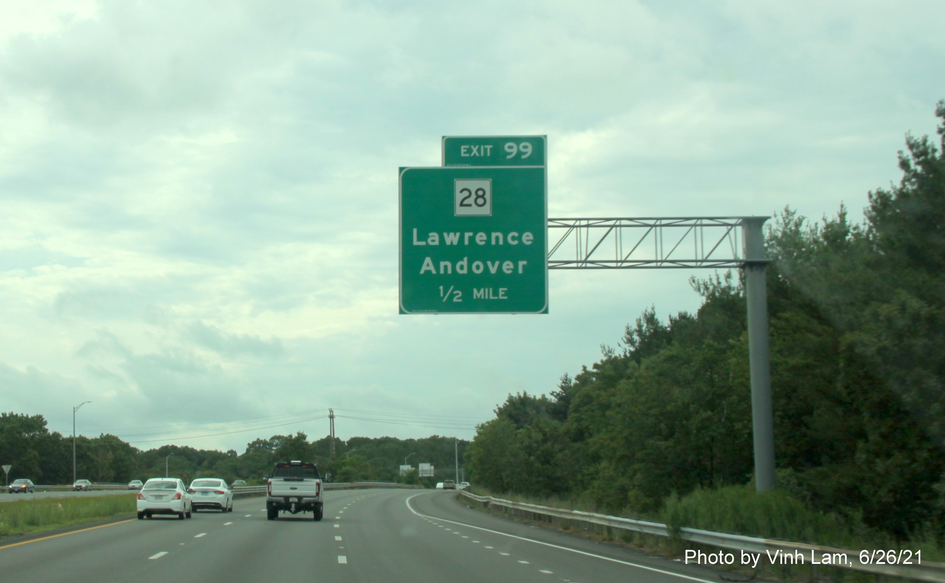 Image of 1/2 mile advance overhead sign for MA 28 exit with new milepost based exit number on I-495 South in Andover, by Vinh Lam, June 2021