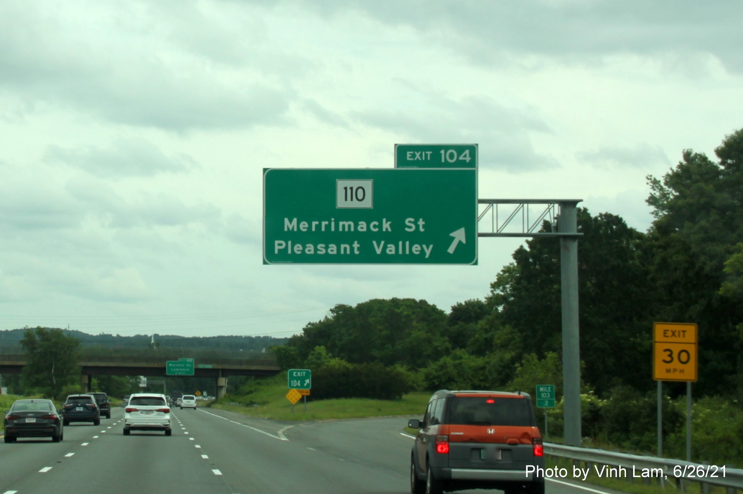 Image of overhead ramp sign for MA 110 exit with new milepost based exit number on I-495 South in Lawrence, photo by Vinh Lam, June 2021