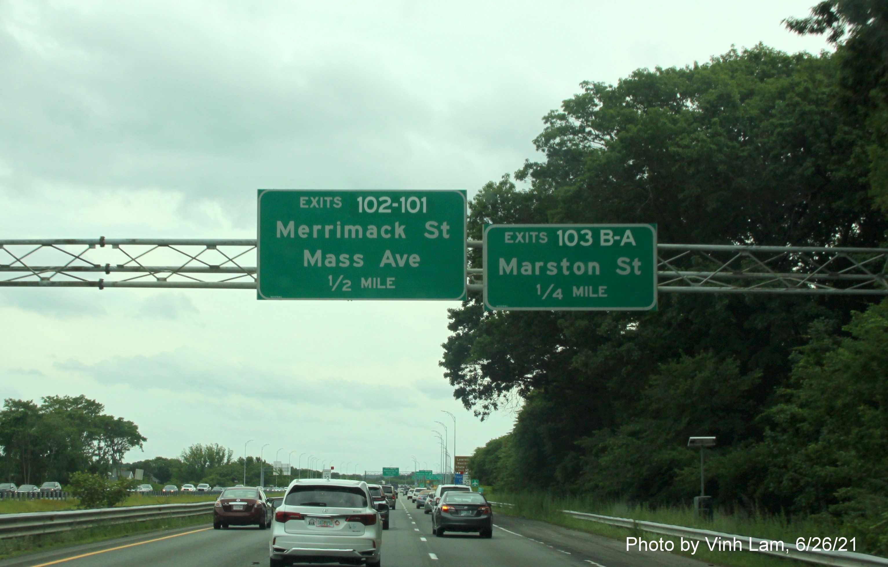 Image of advance overhead signs for /Mass Ave, and Marston Street exits with new milepost based exit numbers on 
                                             I-495 South in Lawrence, photo by Vinh Lam, June 2021