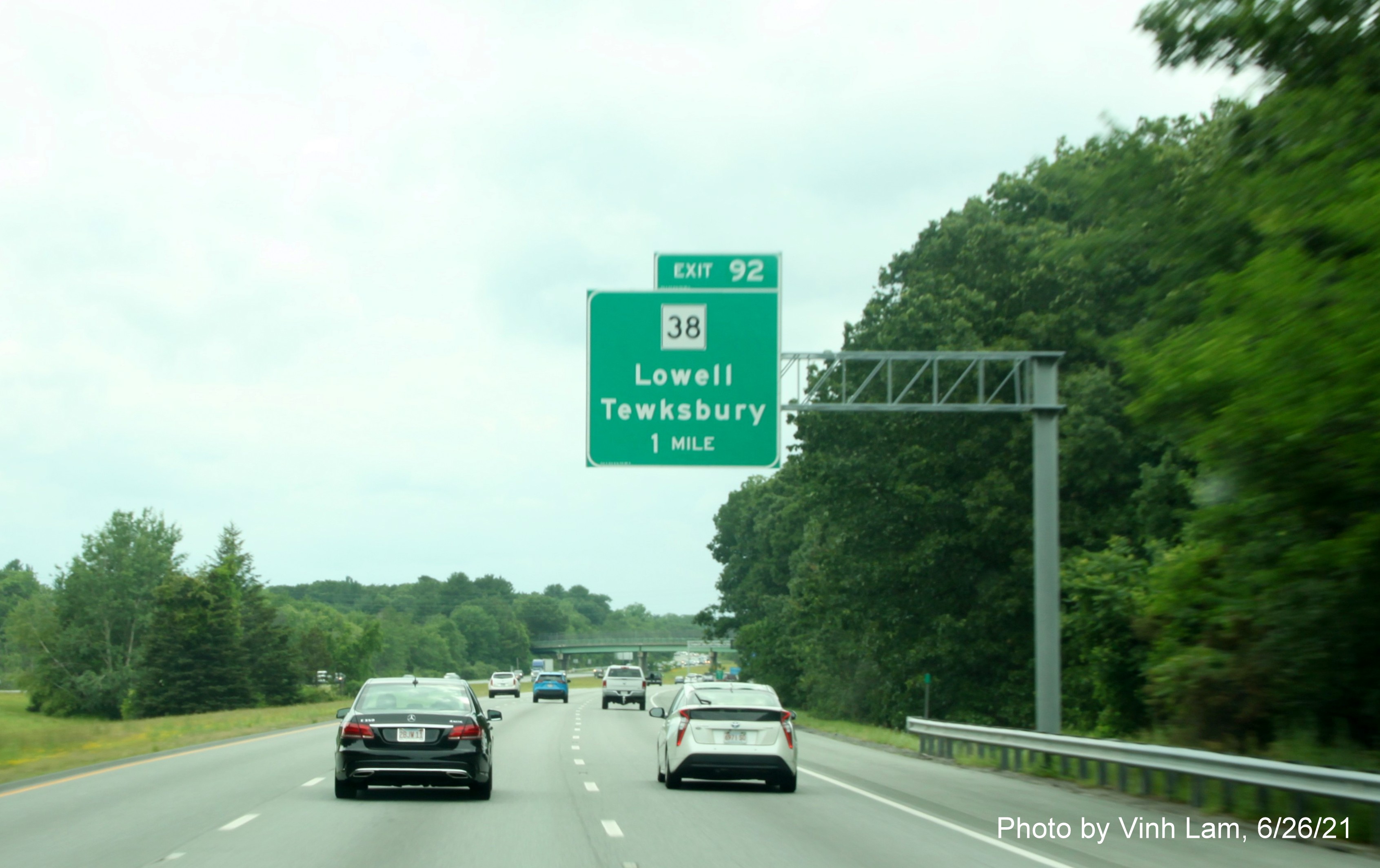 Image of 1 mile advance overhead sign for MA 38 exit with new milepost based exit number, but no old exit sign, on I-495 South in Tewksbury, by Vinh Lam, June 2021