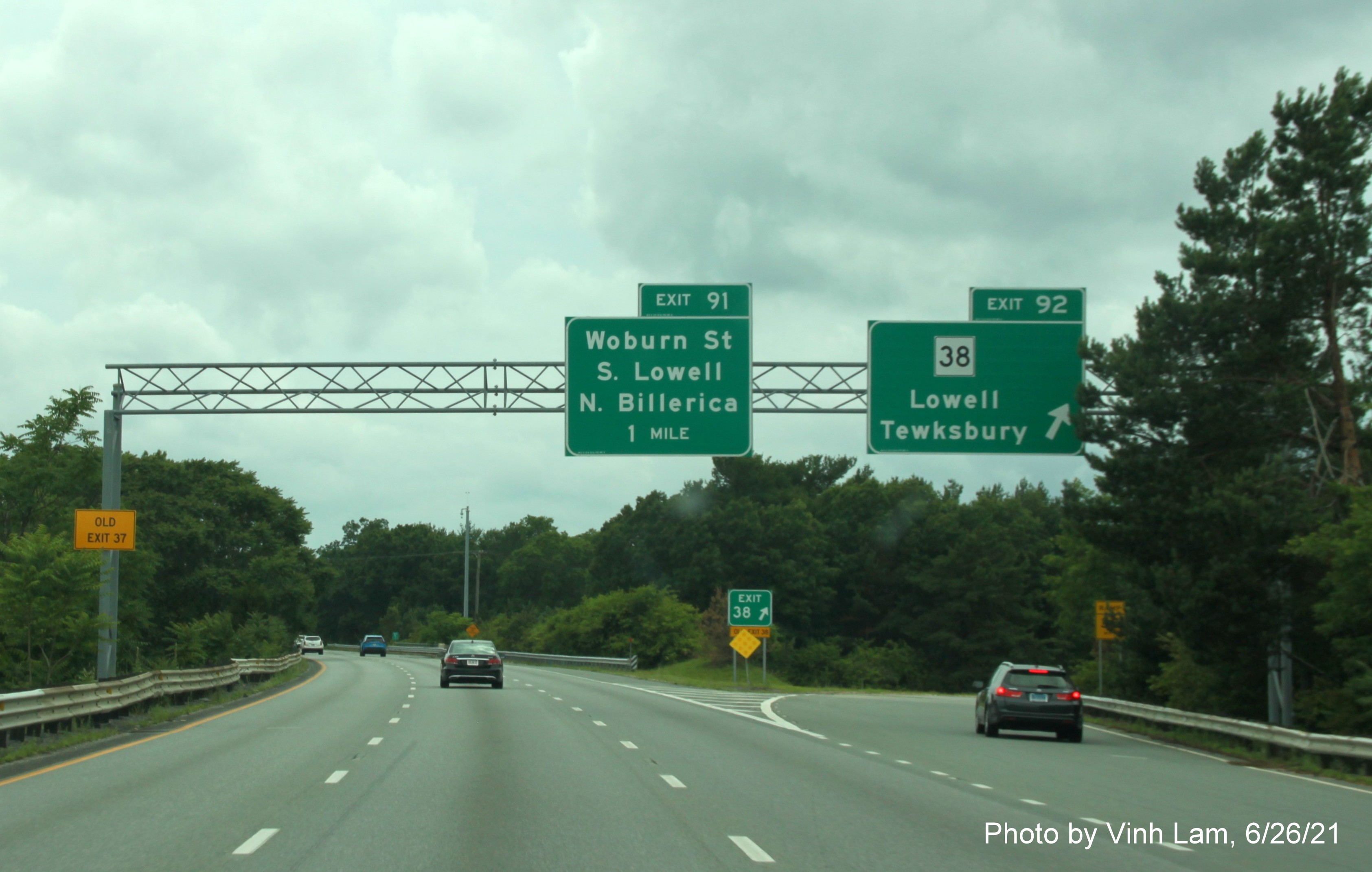 Image of overhead ramp sign for MA 38 exit with new milepost based exit number on I-495 South in Tewksbury, by Vinh Lam, June 2021