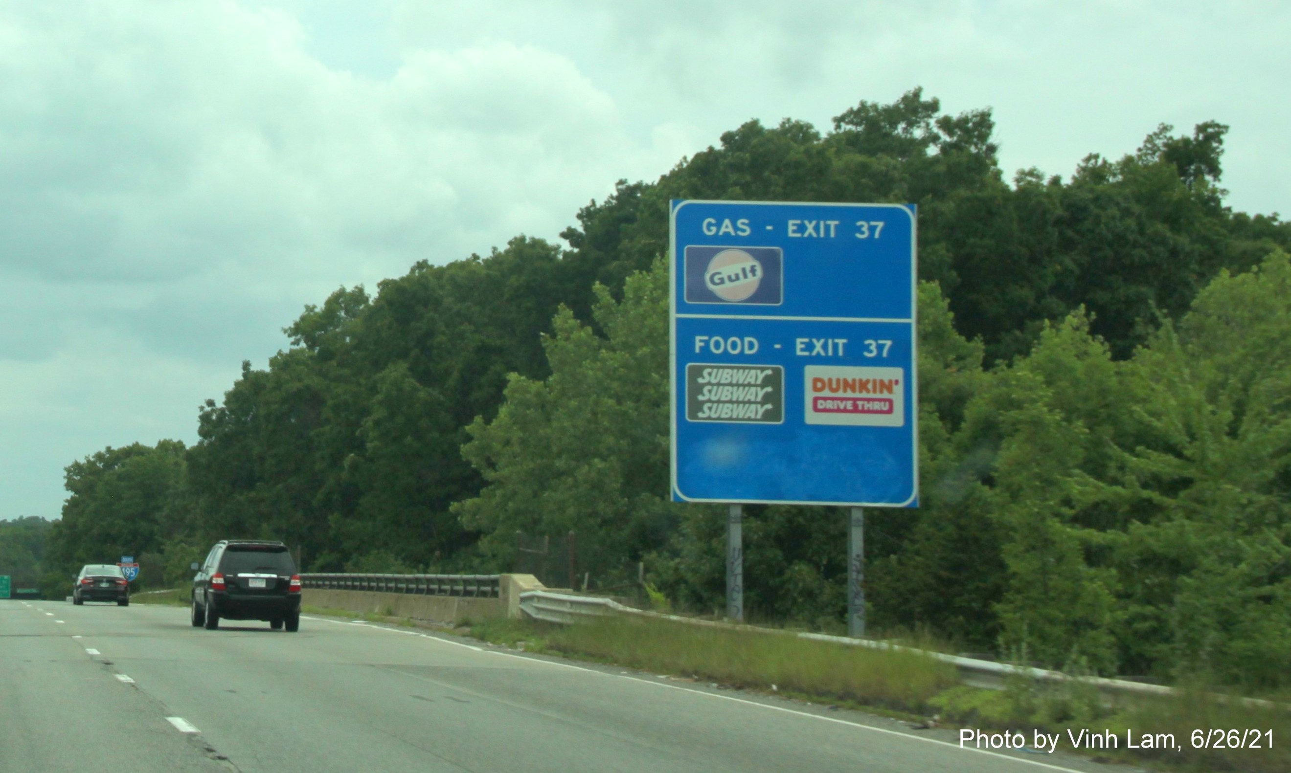 Image of blue combination Gas and Food services sign for Woburn Street exit with old sequential exit number on I-495 South in Tewksbury, by Vinh Lam, June 2021