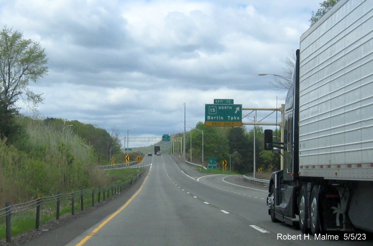 Image of overhead signage at ramp for CT 15 North exit with new milepost based exit number on I-691 West in Meriden CT, May 2023