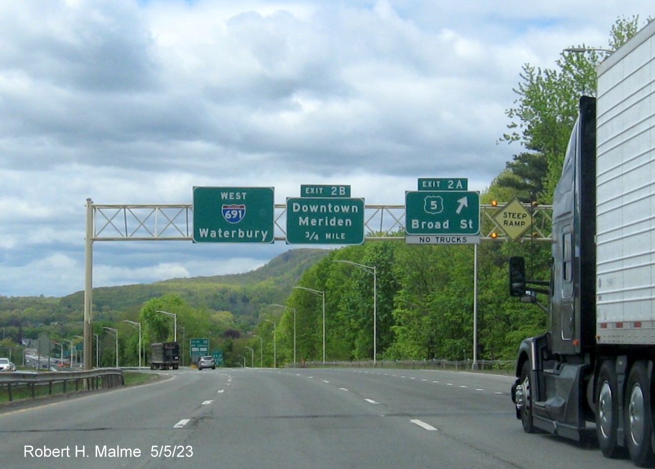 Image of overhead ramp signage for US 5 exit with new milepost based exit number on I-691 West in Meriden CT, May 2023