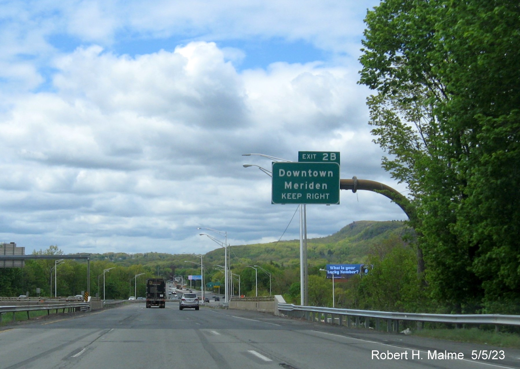 Image of overhead ramp sign for Downtown Meriden exit with new milepost based exit number on I-691 West in Meriden CT, May 2023