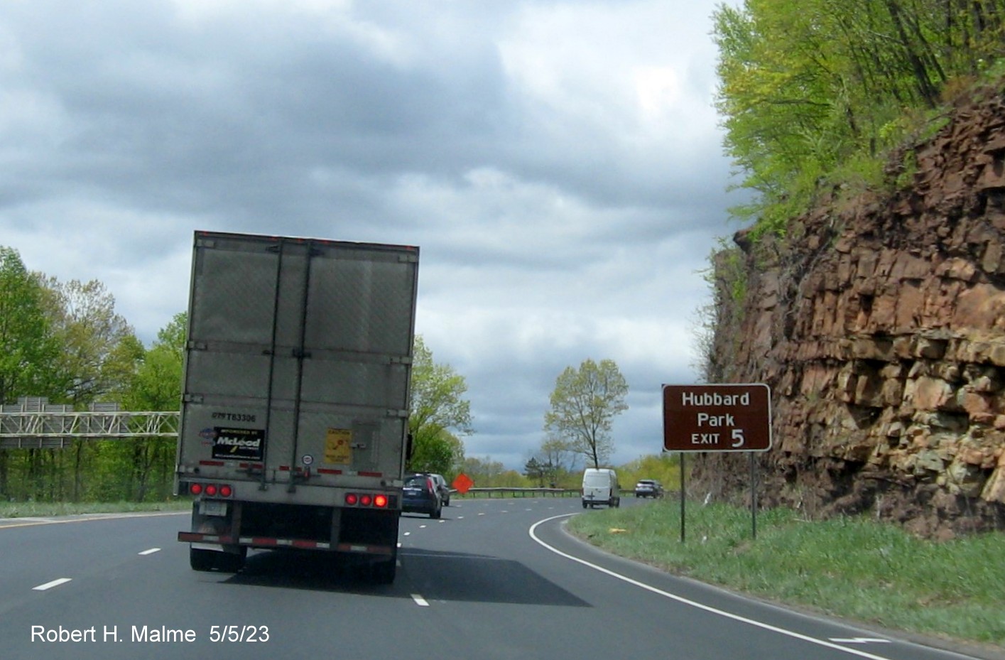 Image of brown auxiliary sign for CT 322 exit with new milepost based exit number on I-691 West in Southington, May 2023