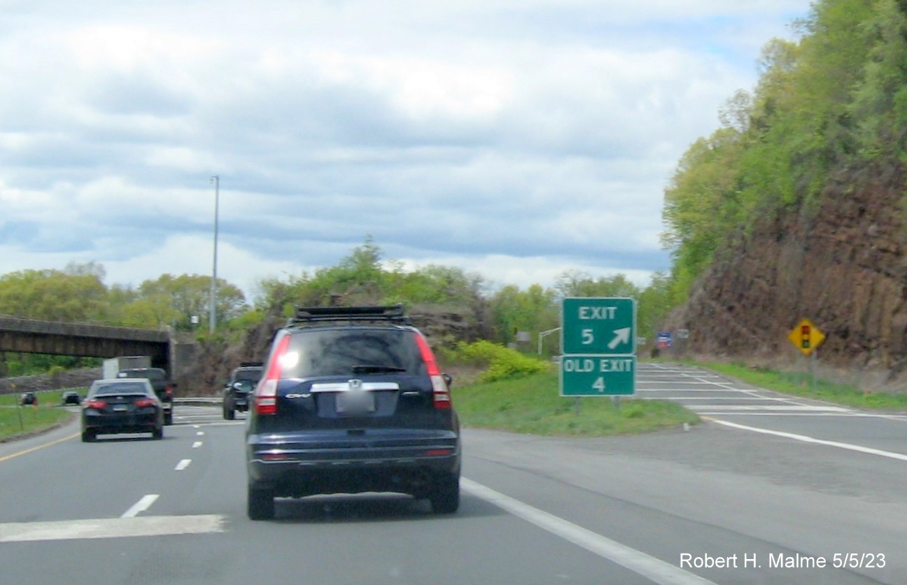 Image of gore sign for CT 322 exit with new milepost based exit number and Old Exit 4 sign below on I-691 
                                      West in Southington, May 2023