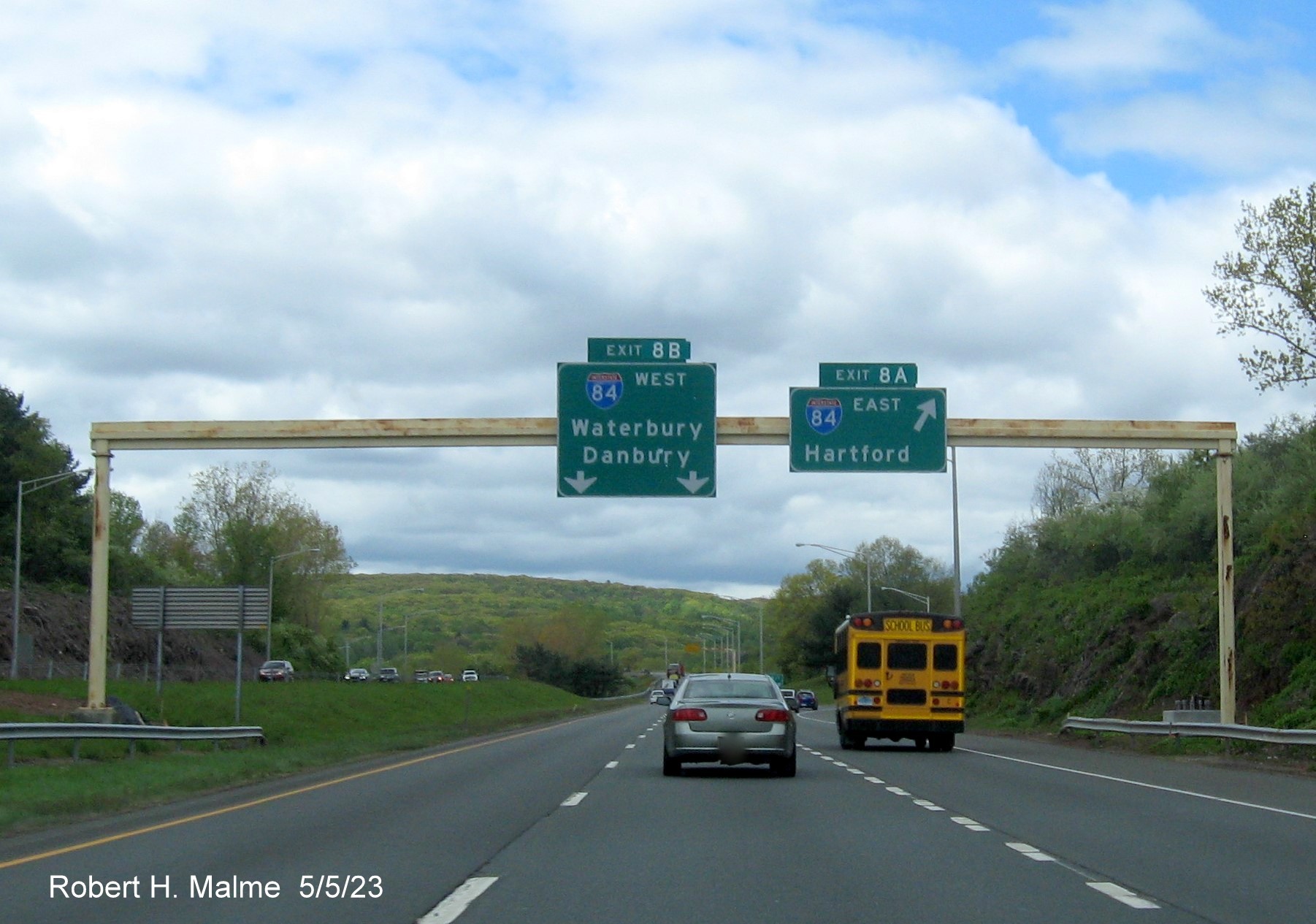 Image of overheag ramp sign for I-84 East exit with new milepost based exit number on I-691 West in Cheshire, May 2023