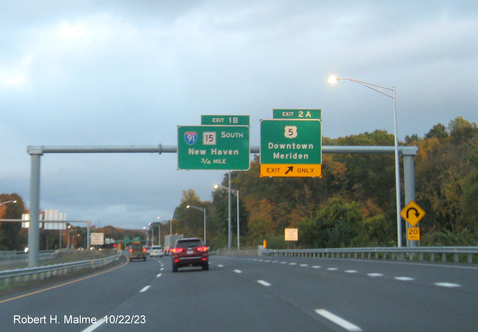 Image of new 1 mile advance sign for the I-91/CT 15 South exit and exit sign for US 5 with the new milepost based exit number, October 2023