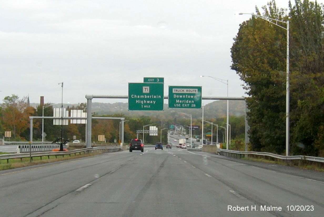 Image of new overhead signs for the CT 71 and Downtown Meriden exits with new milepost based exit numbers 
         on I-691 West in Meriden, October 2023