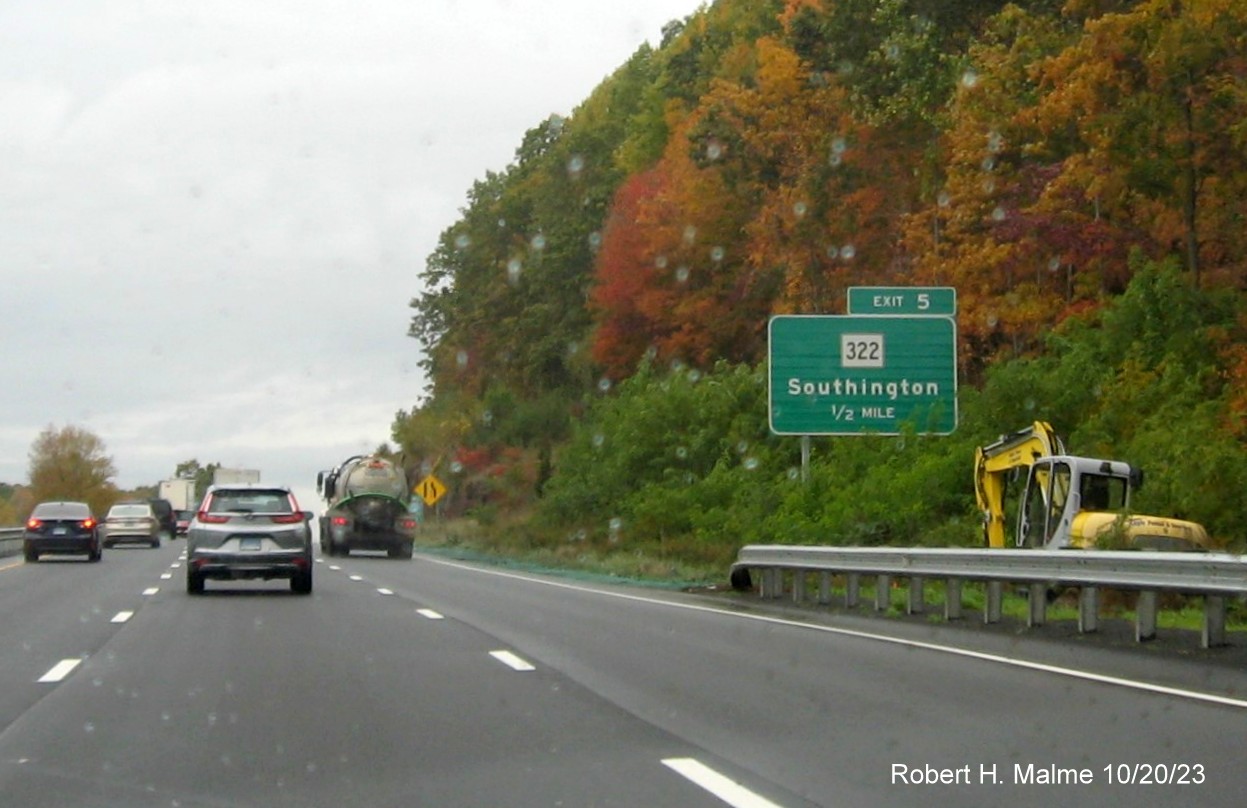 Image of new ground mounted 1/2 mile advance sign for the CT 322 exit with new milepost based exit number 
         on I-691 West in Southington, October 2023