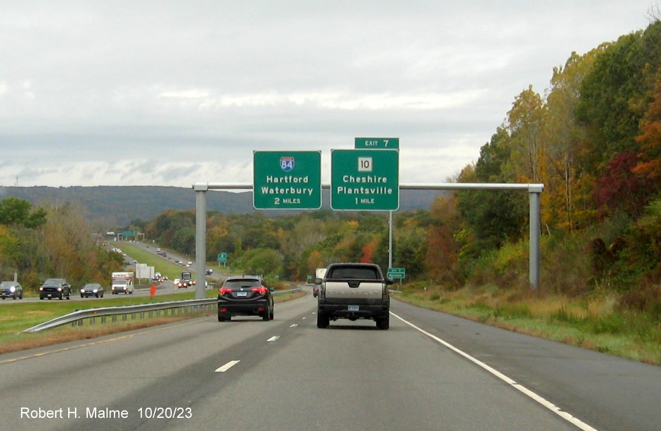 Image of new overhead signs for the I-84 and CT 10 exits with new milepost based exit number 
         on I-691 West in Cheshire, October 2023