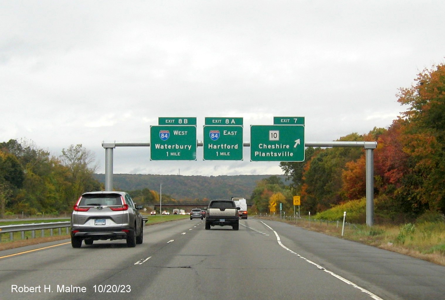 Image of new overhead signs at the CT 10 exit with new milepost based exit number 
         on I-691 West in Cheshire, October 2023