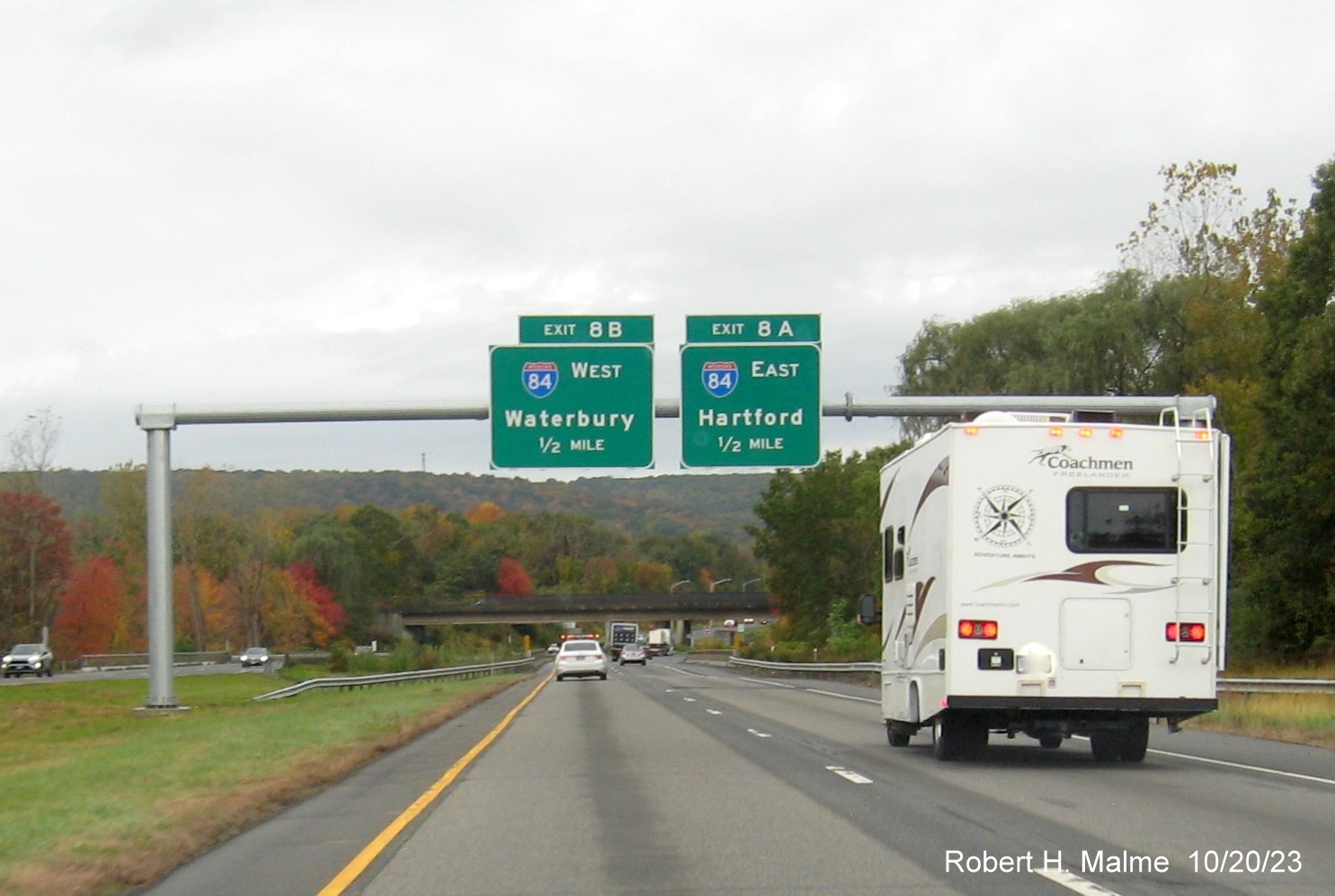 Image of new overhead signs for the I-84 exits with new milepost based exit number 
         on I-691 West in Cheshire, October 2023