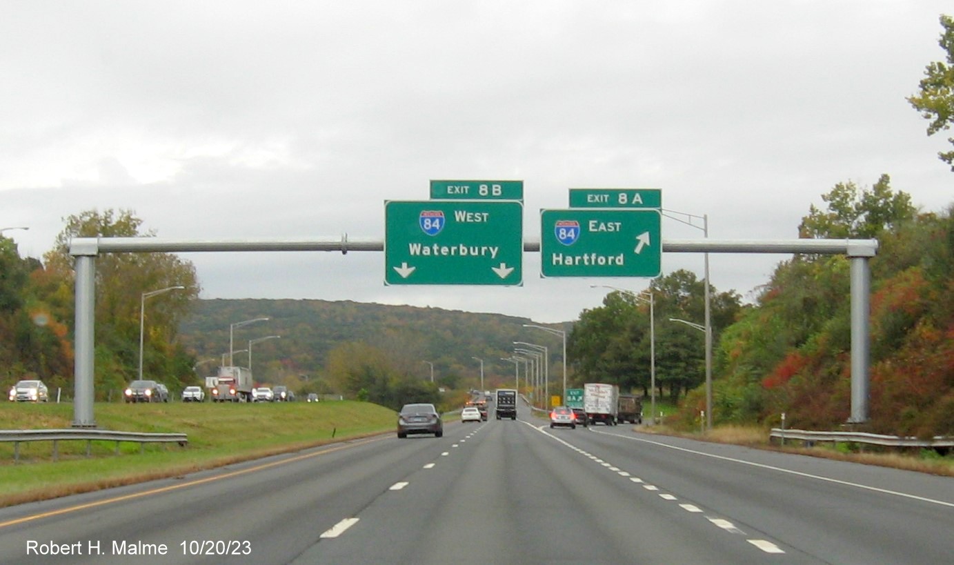 Image of new overhead signs at the CT 10 exit with new milepost based exit number 
         on I-691 West in cheshire, October 2023