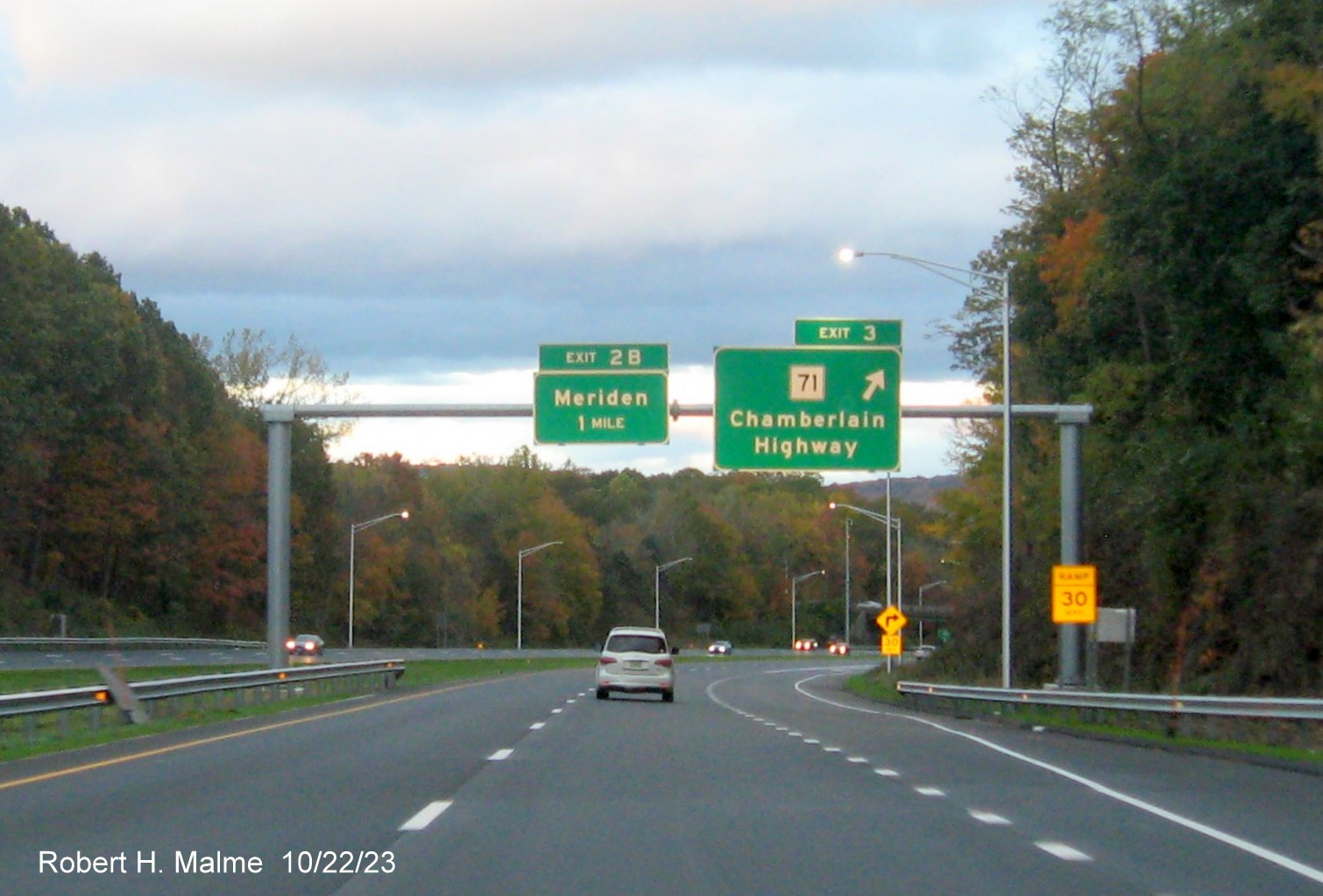 Image of new one mile advance sign for the Merdien exit with exit sign for NC 71 with the new milepost 
      based exit numbers, October 2023
