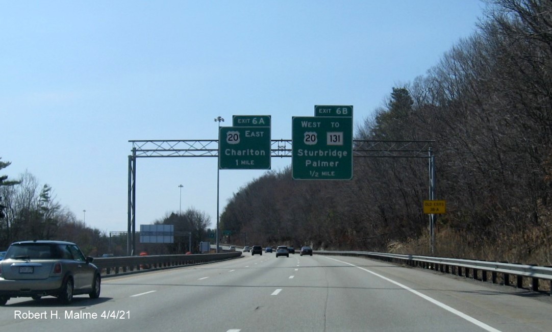 Image of overhead signage for US 20 exits with new milepost based exit numbers and yellow Old Exits 3 B-A advisory sign on right support on I-84 West in Sturbridge, April 2021