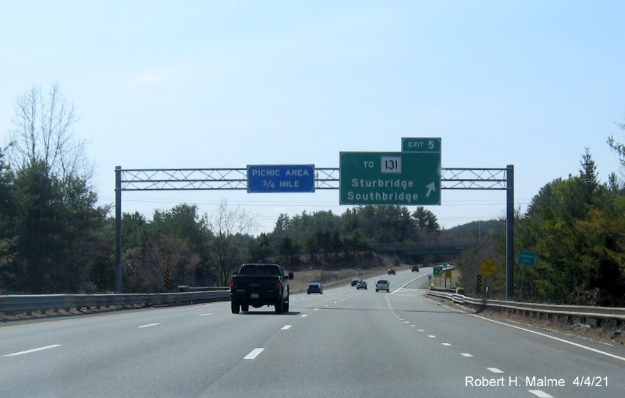 Image of overhead signage at ramp for US 20 West exit with new milepost based exit numbers on I-84 West in Sturbridge, April 2021