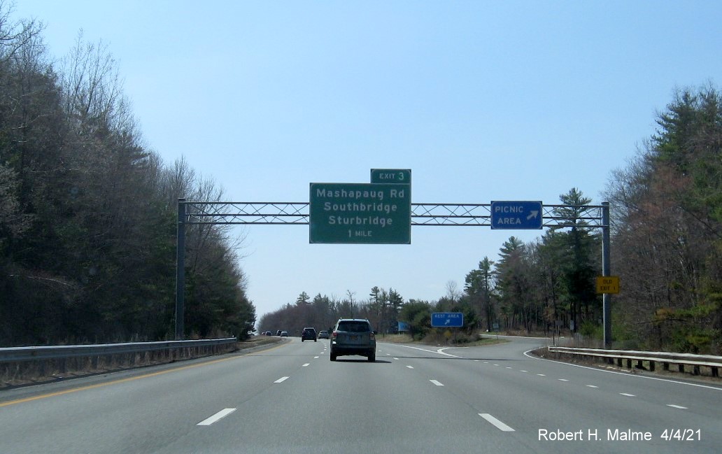 Image of 1 Mile advance overhead sign for Mashapaug Road exit with new milepost based exit number and yellow Old Exit 1 advisory sign on right support on I-84 West in Sturbridge, April 2021