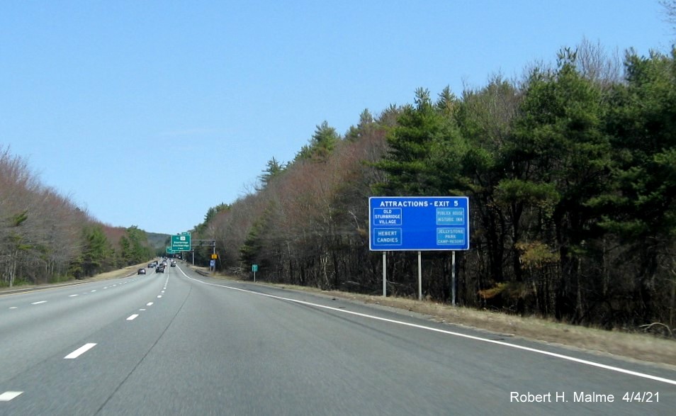 Image of blue Lodgings services sign for To MA 131 exit with new milepost based exit number on I-84 East in Sturbridge, April 2021