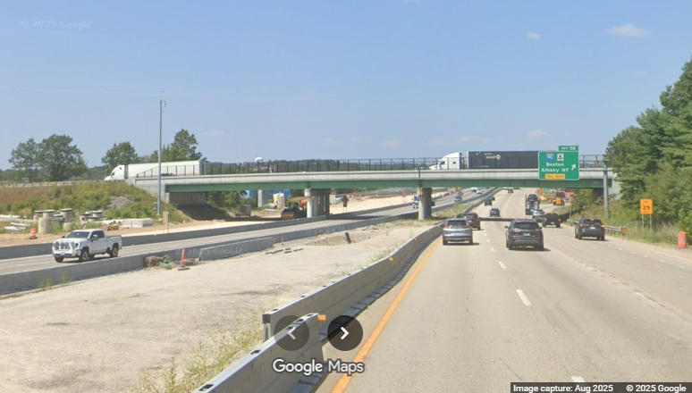 Image of supports being constructed for future flyover ramp from I-90/Mass Pike West
	on I-495 North in Hopkinton, Google Maps Street View, August 2025