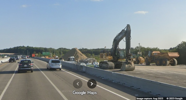 Image of construction equipment in future I-495 South lanes on new bridge over I-90/
	Mass Pike in Hopkinton, Google Maps Street View, August 2025