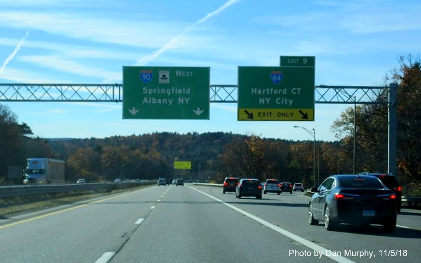 Image of newly placed overhead signs at I-84 exit ramp along I-90/Mass Pike West in Nov. 2018