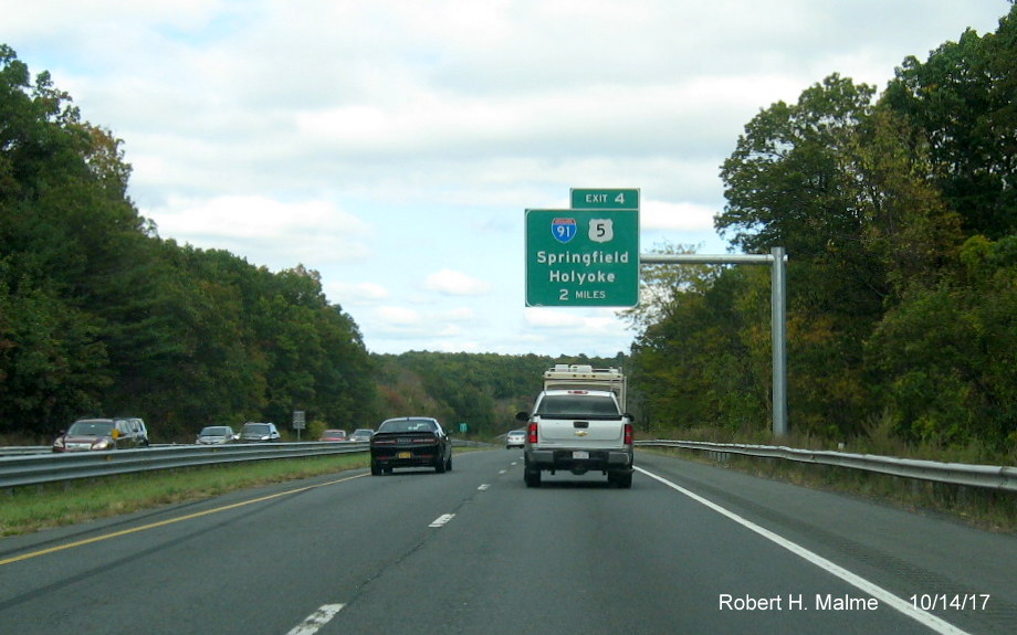 Image of newly placed 2-Mile advance overhead sign for I-91/US 5 exit on I-90/Mass Pike East in West Springfield