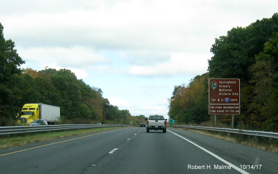 Image of newly placed brown auxiliary sign on I-90/Mass Pike East for I-91 Exit in West Springfield
