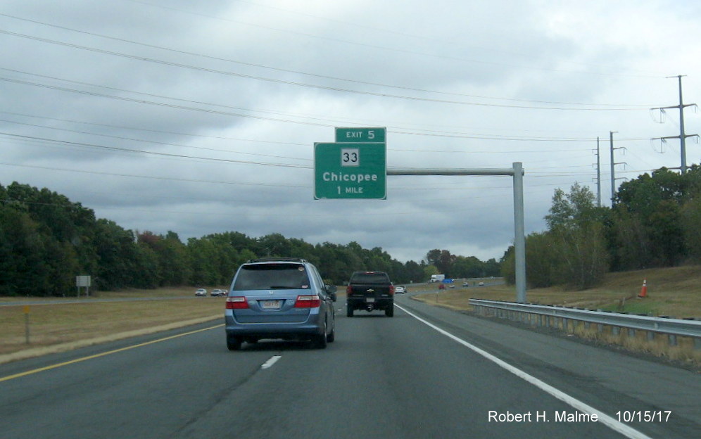 Image of newly placed 1-Mile advance sign for MA 33 exit on I-90/Mass Pike East in Chicopee