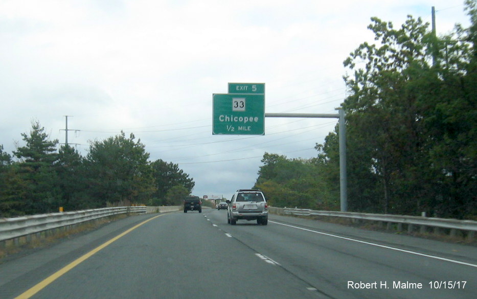 Image of newly placed 1/2 mile advance overhead sign for MA 33 exit on I-90/Mass Pike East in Chicopee