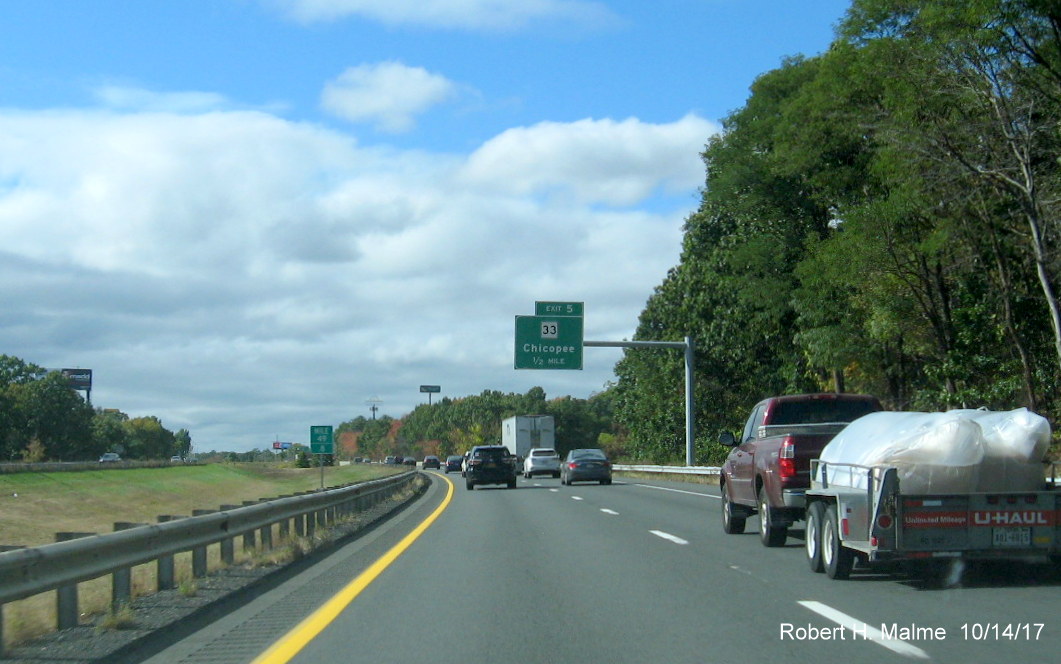 Image of newly installed 1/2 mile advance sign for MA 33 exit on I-90 Mass Pike West in Chicopee