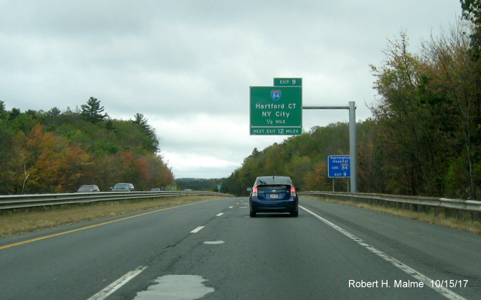 Image of newly placed 1/2 Mile Advance overhead sign for I-84 exit on I-90/Mass Pike East in Sturbridge