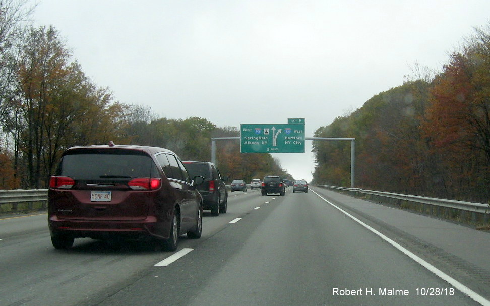 Image of newly placed 2-mile advance diagrammatic overhead sign for I-84 exit on I-90/Mass Pike West in Charlton on Oct. 28, 2018
