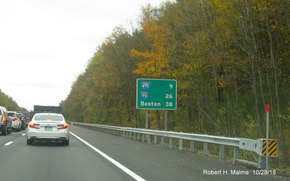 Image of post-interchange distance sign with I-495 and I-95 shields on I-90/Mass Pike East in Millbury